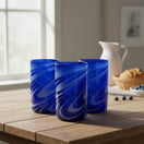 The Talavera Hub handmade blue glass with white swirls, 16 oz, 5.25" tall, 3.25" diameter.