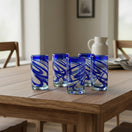 The Talavera Hub hand-blown Mexican drinking glasses with blue swirl design, 20 oz capacity, 6" tall.