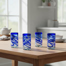 The Talavera Hub hand-blown Mexican drinking glasses with blue swirl design, 20 oz capacity, 6" tall.