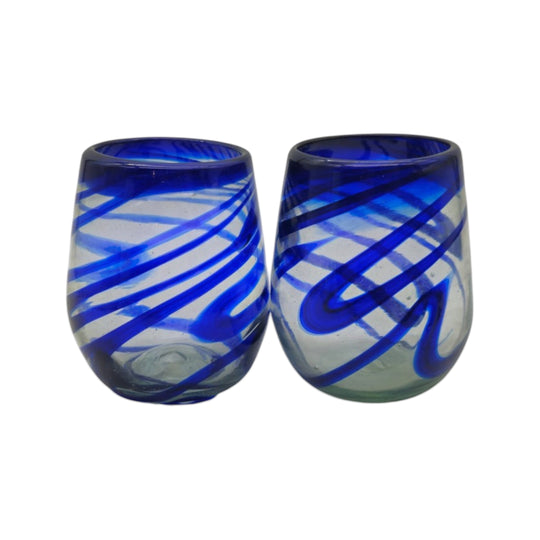 The Talavera Hub hand-blown stemless wine glass with blue swirls, made from recycled glass.
