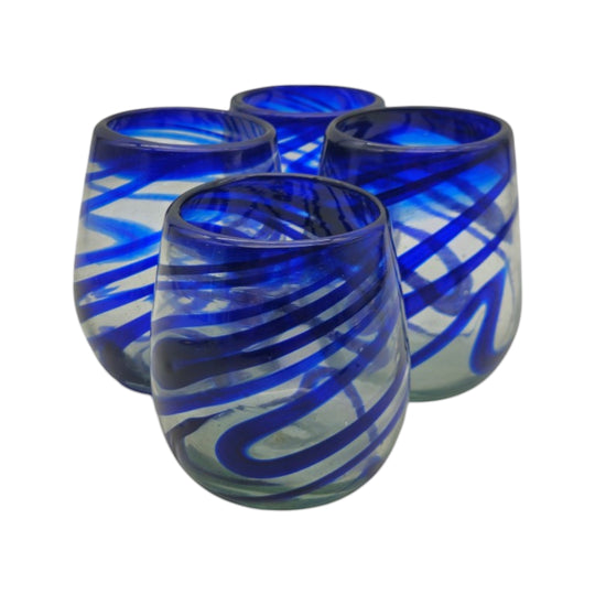 The Talavera Hub hand-blown stemless wine glasses with blue swirls, made from recycled glass.