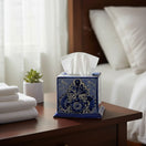 The Talavera Hub blue and white hand-painted ceramic tissue box cover with intricate Mexican floral patterns on a table