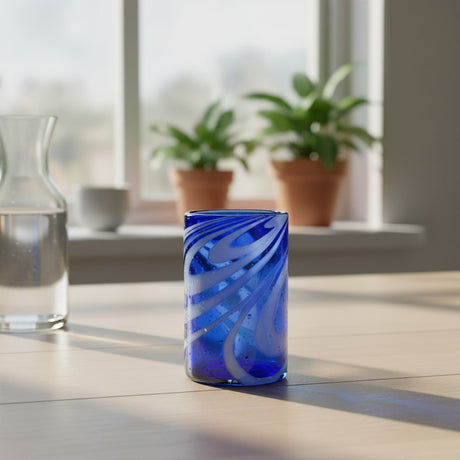 The Talavera Hub blue and white swirl hand-blown glass, 16 oz, 5.25" tall. Perfect for water, juice, or cocktails.