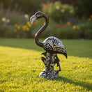 The Talavera Hub hand-painted blue and white ceramic flamingo statue with intricate patterns. Handcrafted pottery bird.