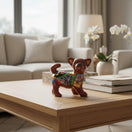 The Talavera Hub brown ceramic Chihuahua figurine with colorful floral and geometric Talavera patterns.