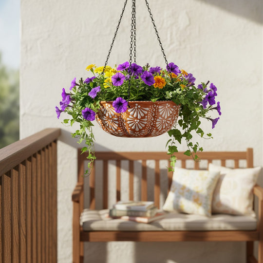 The Talavera Hub brown and white ceramic hanging planter with intricate floral motifs and purple and yellow flowers