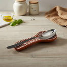 The Talavera Hub brown and white handcrafted ceramic spoon rest with floral relief design.