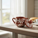 The Talavera Hub brown and white floral relief ceramic sugar jar with lid, handcrafted in Mexico.