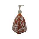 The Talavera Hub handmade ceramic soap dispenser with a brown and white pyramid pattern and white pump top.