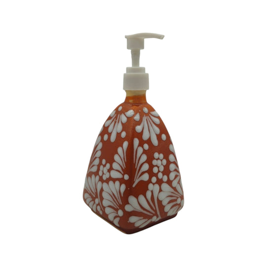 The Talavera Hub handmade ceramic soap dispenser with a brown and white pyramid pattern and white pump top.