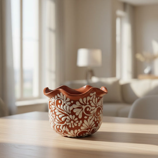 The Talavera Hub brown and white ceramic planter with wavy rim and floral motifs. Handcrafted in Mexico.