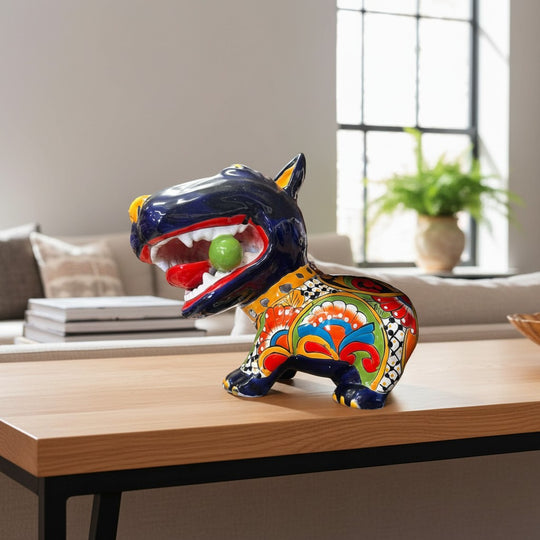 The Talavera Hub extra large, hand-painted ceramic Bull Terrier dog with a green ball in its mouth, featuring vibrant Talavera patterns.