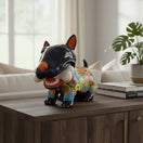 The Talavera Hub hand-painted ceramic Bull Terrier dog with bone, featuring a black body and colorful Talavera patterns.