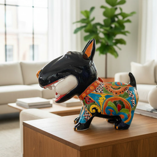 The Talavera Hub hand-painted ceramic Bull Terrier dog decor with bone, featuring vibrant Talavera patterns and a black finish.