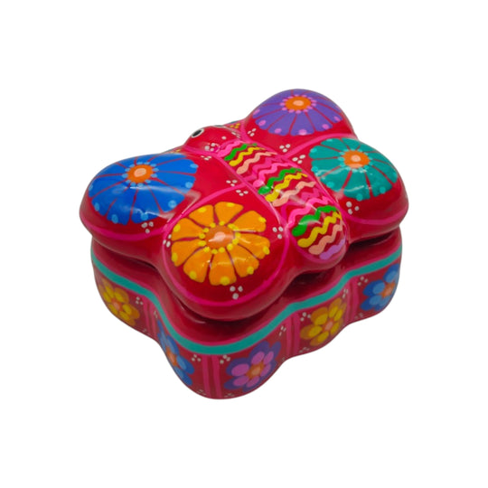 The Talavera Hub hand-painted ceramic butterfly jewelry box in vibrant pink with colorful floral patterns.
