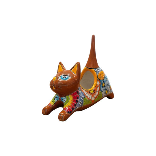 The Talavera Hub handcrafted ceramic stretching cat planter, hand-painted with colorful flowers in blue, red, yellow, and green.