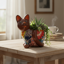 The Talavera Hub medium brown ceramic cat planter, hand-painted with vibrant floral Talavera art.
