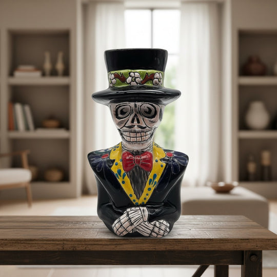 The Talavera Hub handcrafted ceramic Catrin skeleton statue with vibrant hand-painted Day of the Dead details.