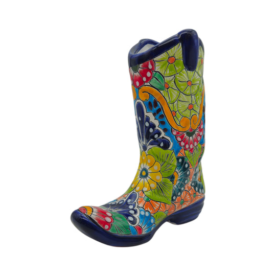 The Talavera Hub hand-painted ceramic cowboy boot planter featuring vibrant floral and geometric Mexican patterns.