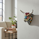 The Talavera Hub handcrafted ceramic bull skull wall art with vibrant, hand-painted Mexican floral Day of the Dead motifs.