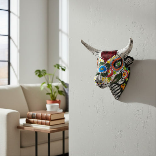 The Talavera Hub handcrafted ceramic bull skull wall art with vibrant, hand-painted Mexican floral Day of the Dead motifs.