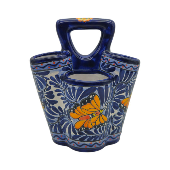 The Talavera Hub handmade ceramic utensil holder with blue and white butterfly design and central handle