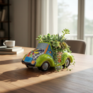 The Talavera Hub hand-painted ceramic car planter in lime green with colorful floral Talavera patterns.