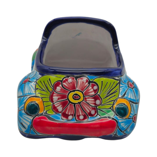 The Talavera Hub small ceramic car planter featuring vibrant hand-painted floral and geometric folk art patterns.