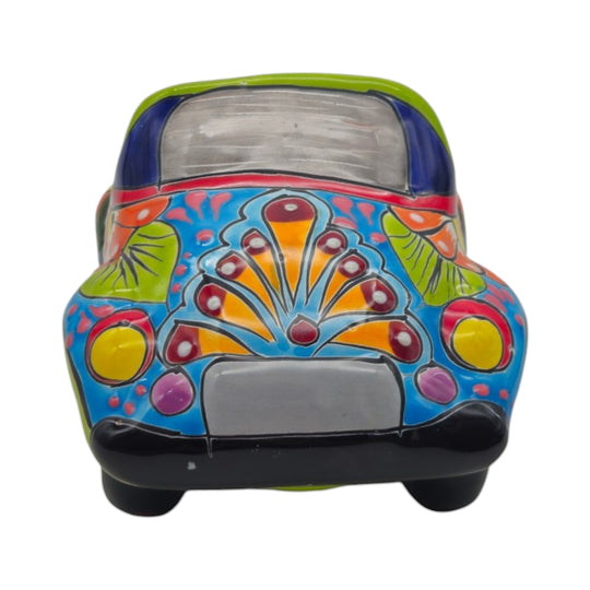 The Talavera Hub handmade ceramic car planter featuring vibrant hand-painted Mexican folk art floral and geometric patterns.