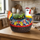 The Talavera Hub hand-painted Mexican ceramic chicken planter with vibrant floral patterns on a wooden kitchen counter.