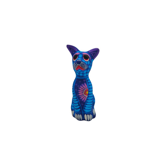 The Talavera Hub 10-inch ceramic sitting dog statue with vibrant blue hand-painted Mexican folk art patterns.