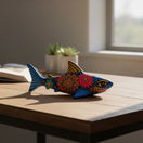 The Talavera Hub handcrafted ceramic shark figurine with vibrant Mexican folk-art patterns on a wooden desk.