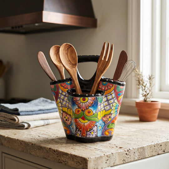 The Talavera Hub hand-painted ceramic utensil holder with vibrant floral patterns and three compartments on a counter.