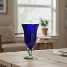 The Talavera Hub hand-blown cobalt blue glass sundae dish with a clear stem and base. 7" tall.