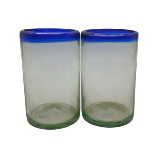 The Talavera Hub hand-blown clear glass tumblers with cobalt blue rims, 5" tall, sold as a set of two.