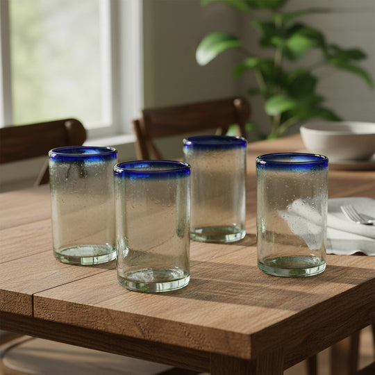 The Talavera Hub hand-blown clear glass tumbler with cobalt blue rim, 5" tall, set of 4.