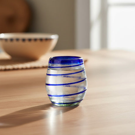 The Talavera Hub hand-blown stemless wine glasses with cobalt blue spiral design. Clear recycled glass, 12 oz capacity.