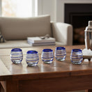 The Talavera Hub hand-blown stemless wine glasses with cobalt blue spiral design, 12 oz capacity.