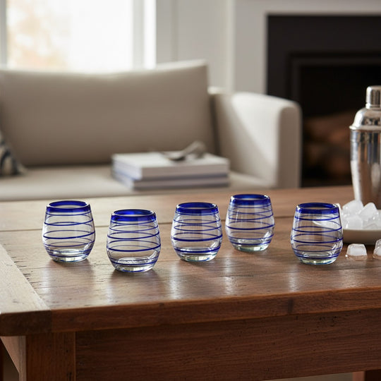 The Talavera Hub hand-blown stemless wine glasses with cobalt blue spiral design, 12 oz capacity.