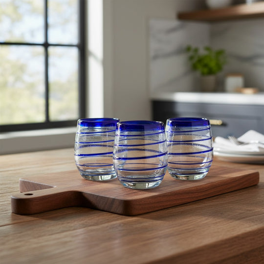 The Talavera Hub hand-blown stemless wine glasses with cobalt blue spiral design. Set of 4, 12 oz capacity.