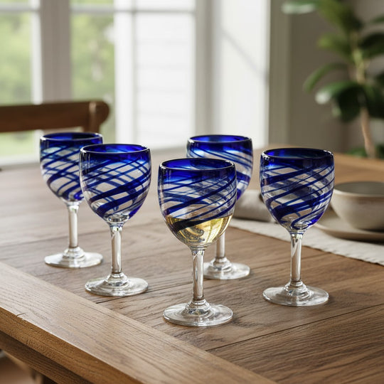 The Talavera Hub hand-blown cobalt blue swirl wine glass goblet, 12 oz, 7.5" tall. Recycled glass.