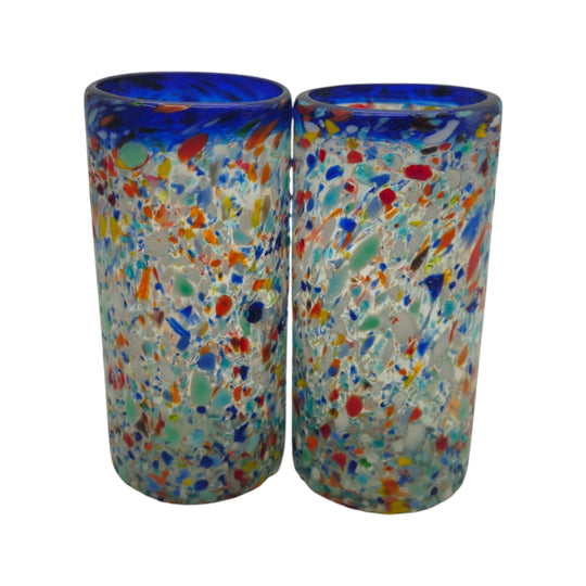 The Talavera Hub hand-blown glass tumbler with confetti pattern and cobalt blue rim. Clear glass with colorful chips and pebbled texture.