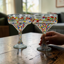 The Talavera Hub hand-blown glass margarita glasses with colorful confetti speckle design. Lead-free glass.