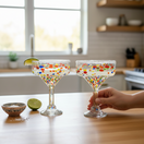 The Talavera Hub hand-blown clear glass margarita glasses with colorful confetti speckle design. Lead-free glass.