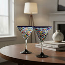 The Talavera Hub hand-blown glass martini glass with confetti pattern and blue rim. Holds 12 oz.