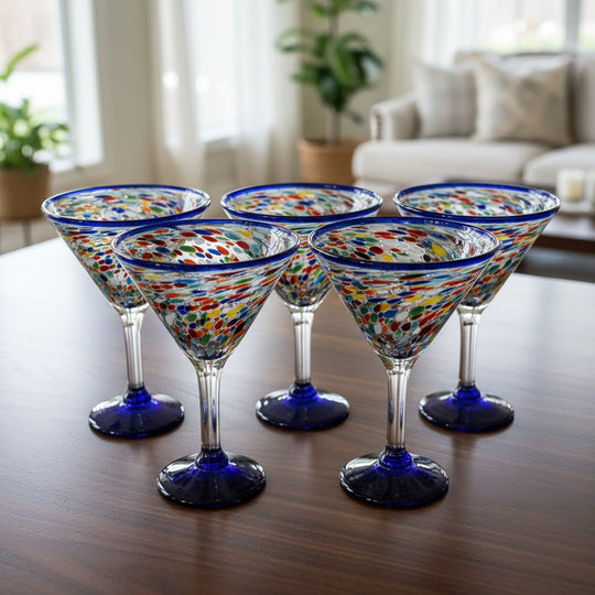 The Talavera Hub hand-blown glass martini glasses with confetti pattern and blue rim. Set of four.