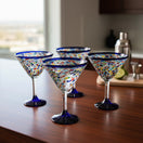 The Talavera Hub hand-blown glass martini glasses with confetti pattern and blue rim. Set of 6.