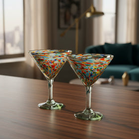 The Talavera Hub Confetti Pebbled Martini Glass, hand-blown recycled glass with colorful confetti pattern and clear rim.
