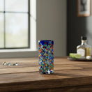 The Talavera Hub hand-blown glass double shot glass with multicolor confetti accents and blue rim.