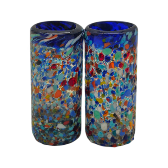 The Talavera Hub hand blown double shot glasses with multicolor confetti and blue rim, made of recycled glass.